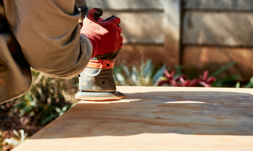 Man using wood sander